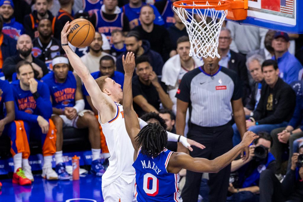 Donte DiVincenzo slams home a dunk over Tyrese Maxey during the Knicks' loss.