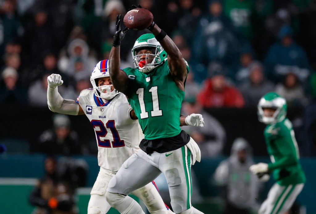 Philadelphia Eagles wide receiver A.J. Brown (11) makes a catch as Buffalo Bills safety Jordan Poyer (21) defends during an NFL football game Nov. 26, 2023, in Philadelphia. The Eagles and Brown have agreed to a three-year contract extension. 