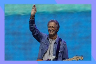 Eric Clapton waves to the crowd.