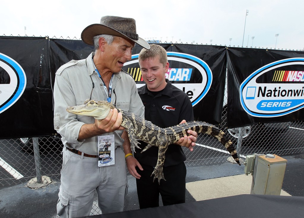 Hanna an NASCAR driver Justin Allgaier holding an alligator at Kentucky Speedway on June 12, 2010 in Sparta, Kentucky.