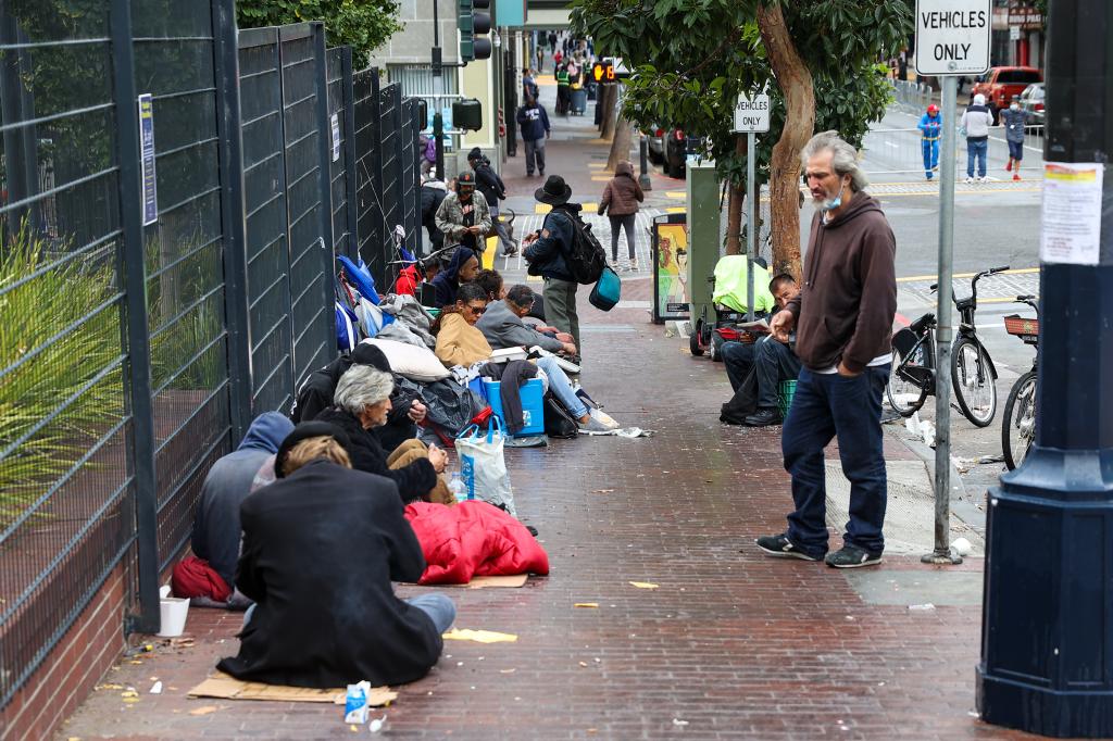 Homeless people are seen on streets of the Tenderloin district in San Francisco, California, United States on October 30, 2021.