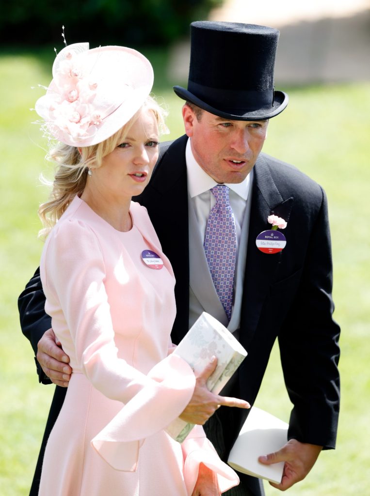 Lindsay Wallace and Peter Phillips, both dressed in suits, attending Day 4 of the Royal Ascot in Ascot, England on June 17, 2022.