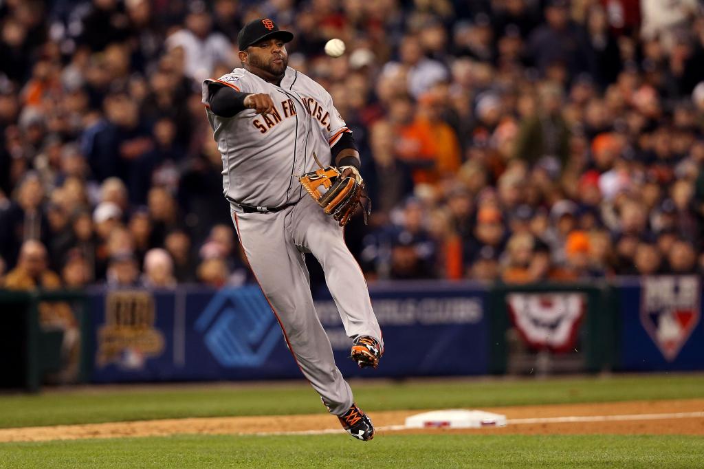 Pablo Sandoval #48 of the San Francisco Giants fails to make a throw hit by Austin Jackson #14 of the Detroit Tigers in the third inning during Game Three of the Major League Baseball World Series at Comerica Park on October 27, 2012 in Detroit, Michigan. 