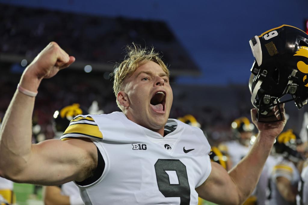Tory Taylor #9 of the Iowa Hawkeyes celebrates after the Hawkeyes defeated the Wisconsin Badgers at Camp Randall Stadium on October 14, 2023 in Madison, Wisconsin.