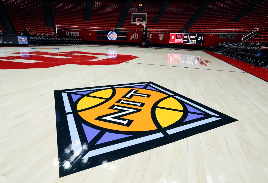 The National Invitation Tournament decal is seen on the court before the start of the quarterfinal game of the NIT Basketball Tournament between the Utah Utes and the VCU Rams at the Jon M Huntsman Center.