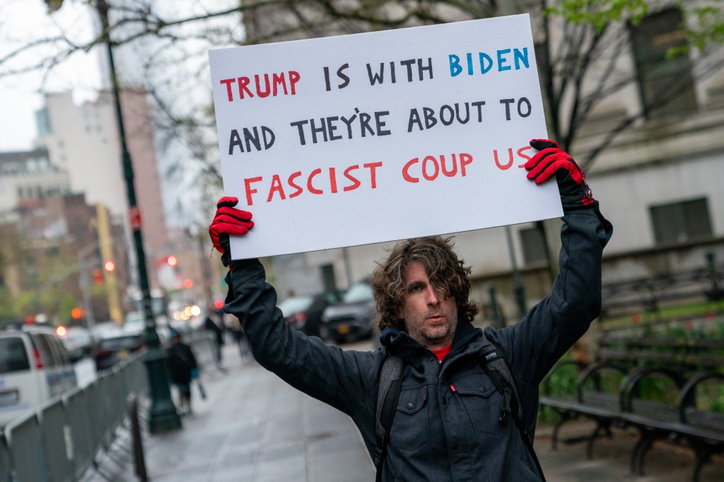 Max Azzarello protests outside of the Manhattan courthouse where former U.S. President Donald Trump's hush money trial is underway on April 18, 2024 in New York City.