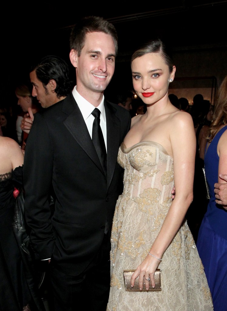 Evan Spiegel and Miranda Kerr posing at the Fifth Annual Baby2Baby Gala in Culver City, California
