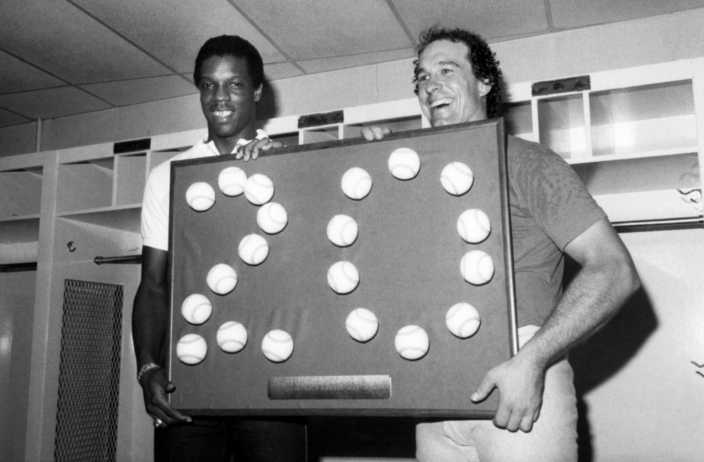 Mets ace Dwight Gooden celebrates his 20th win with catcher Gary Carter after defeating the Padres on August 25, 1985 at Shea Stadium.