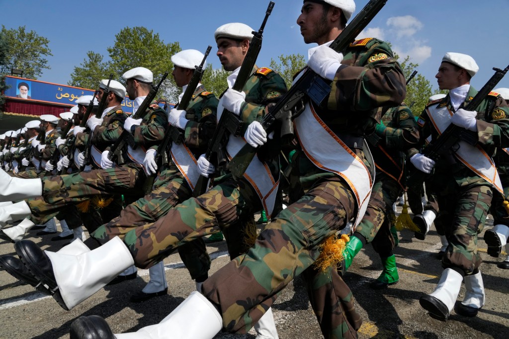 Iranian army members march during Army Day parade at a military base in northern Tehran, Iran, Wednesday, April 17, 2024. 