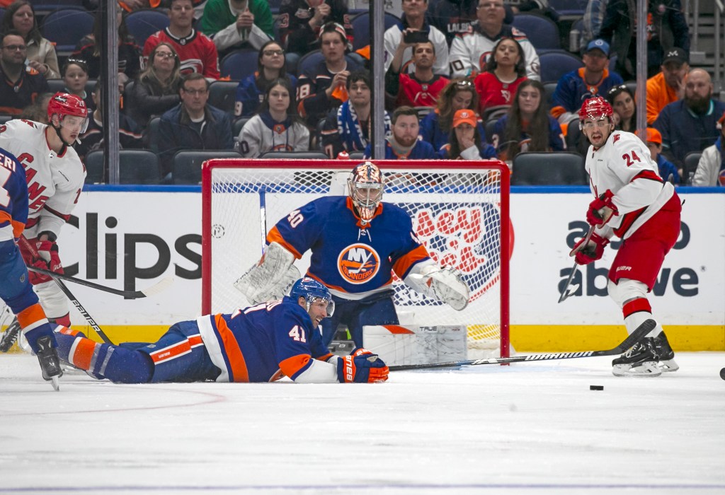 Robert Bortuzzo #41 of the New York Islanders deflects the puck in the third period during Game 4