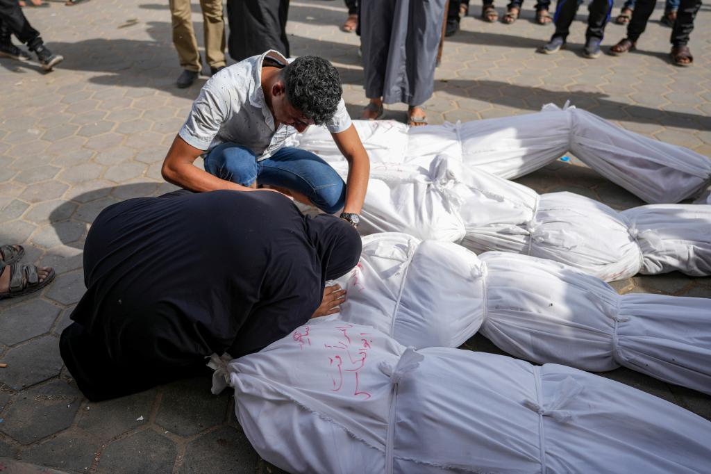 Palestinians mourn their relatives killed in the Israeli bombardment of the Gaza Strip at the Al Aqsa hospital in Deir al Balah, Thursday, April 25, 2024. 