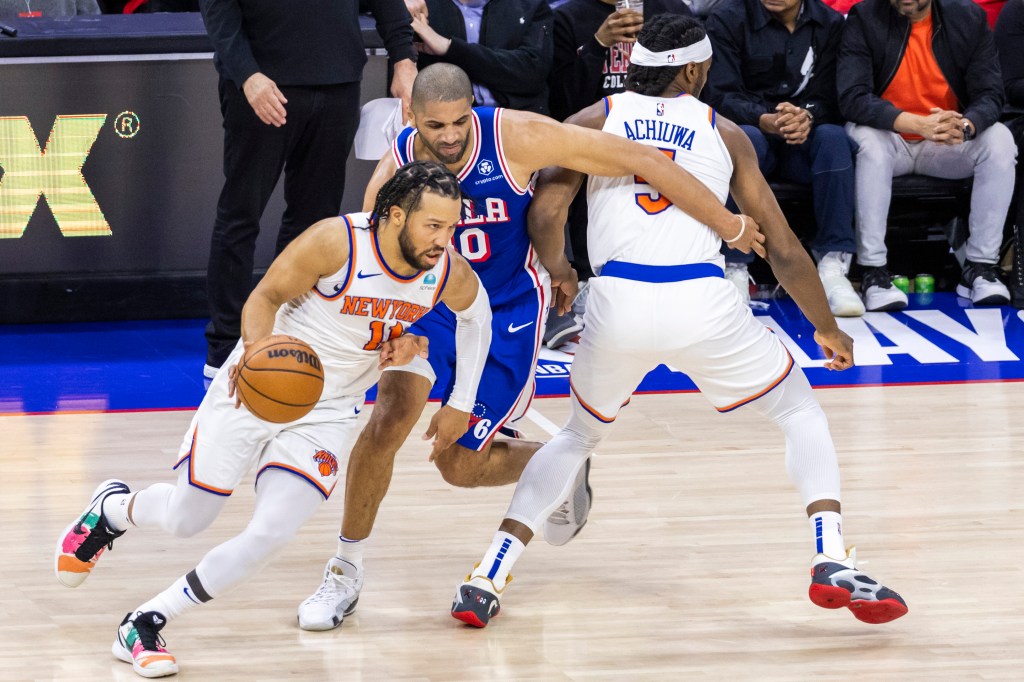 Jalen Brunson drives past Nicolas Batum after taking advantage of a pick set by Precious Achiuwa during the Knicks' loss.