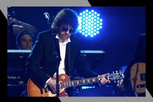 ELO frontman Jeff Lynne rocks out on guitar.