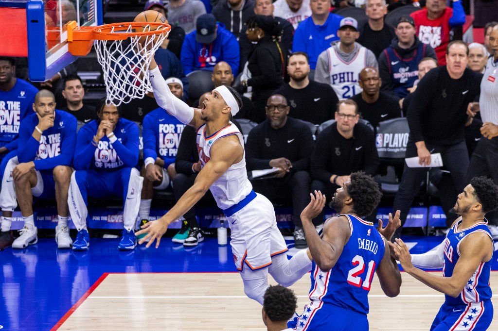 Josh Hart goes up for a layup after driving past Joel Embiid during the Knicks' loss.