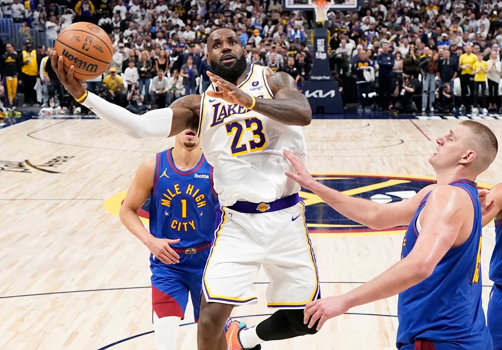 LeBron James, who scored 27 points, goes up for a layup during the Lakers' loss.