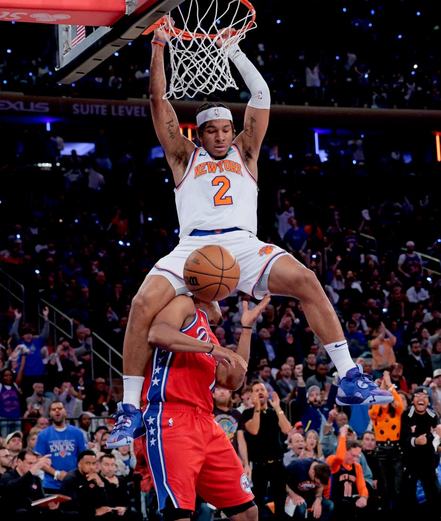 Miles McBride slams home two of his 21 points in the Knicks' win.