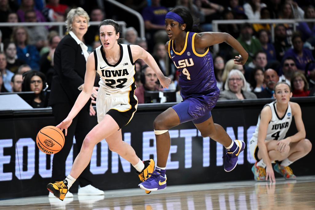 Iowa guard Caitlin Clark (22) drives down court against LSU guard Flau'jae Johnson (4) during the third quarter of an Elite Eight round college basketball game during the NCAA Tournament, Monday, April 1, 2024, in Albany, N.Y
