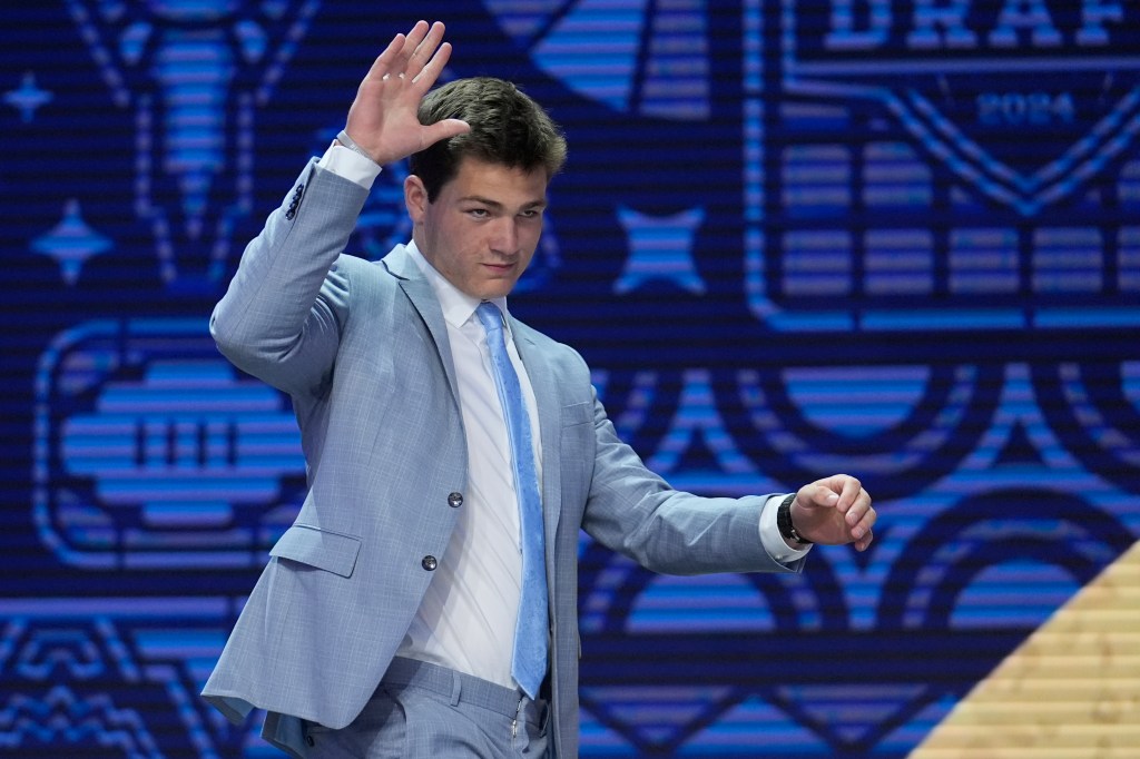 North Carolina quarterback Drake Maye walks on stage during the first round of the NFL football draft, Thursday, April 25, 2024, in Detroit. 