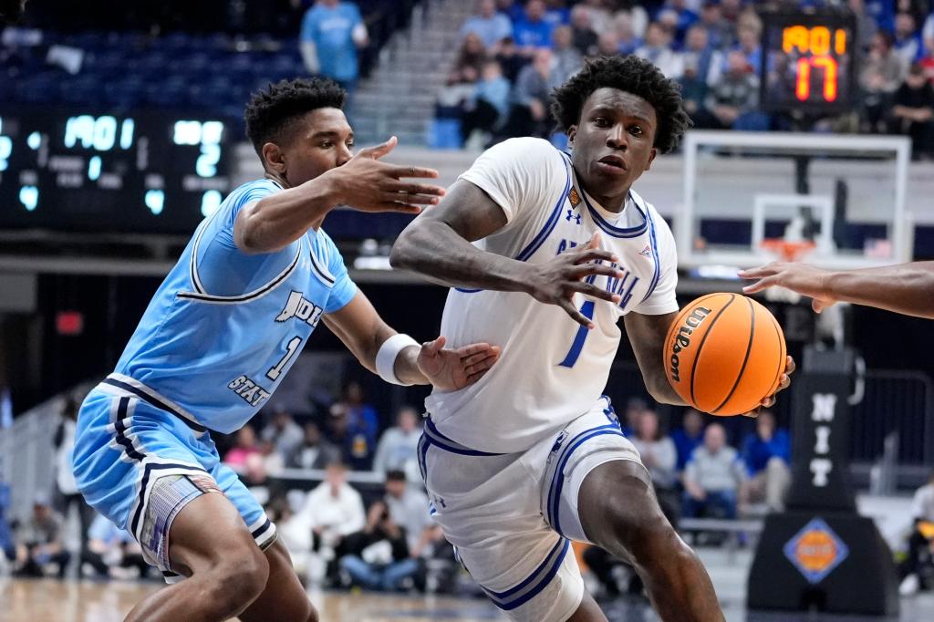 Seton Hall guard Kadary Richmond drives past Indiana State guard Julian Larry during the first half of an NCAA college basketball game for the championship of the NIT, Thursday, April 4, 2024, in Indianapolis. 