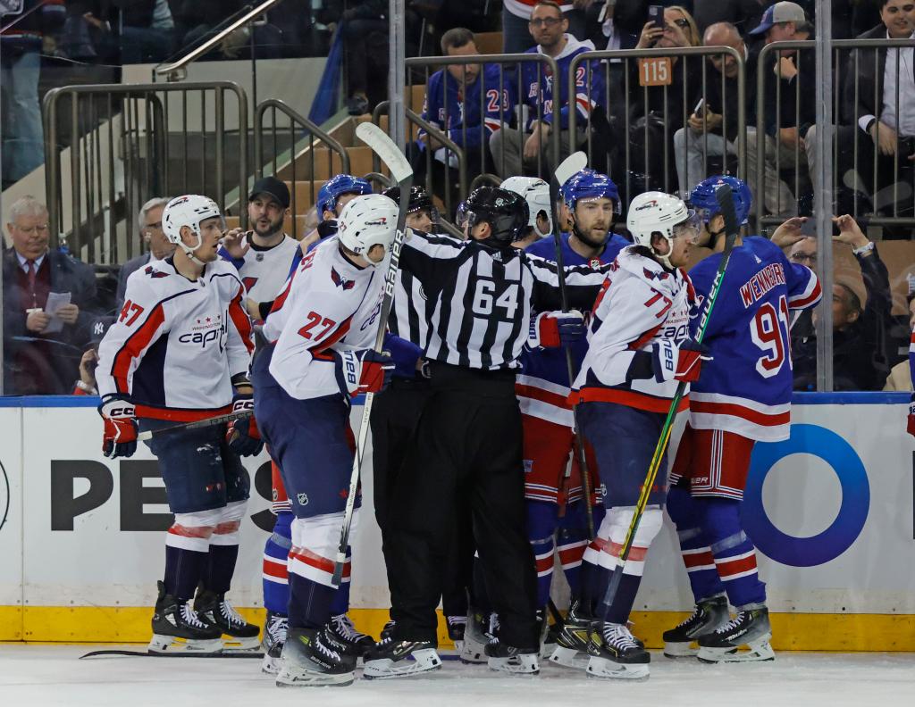 A scuffle breaks out on the ice between the New York Rangers and the Washington Capitals during the second period.