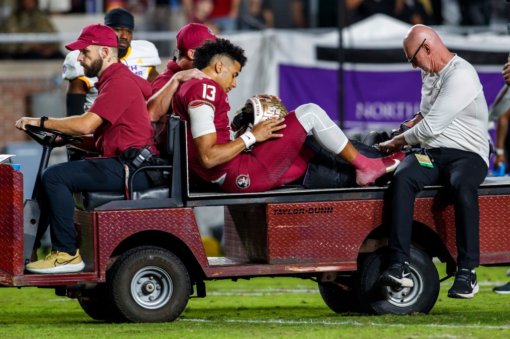 Florida State quarterback Jordan Travis is taken off the field after being injured during the first half of the team's NCAA college football game against North Alabama, Saturday, Nov. 18, 2023, in Tallahassee, Fla. 