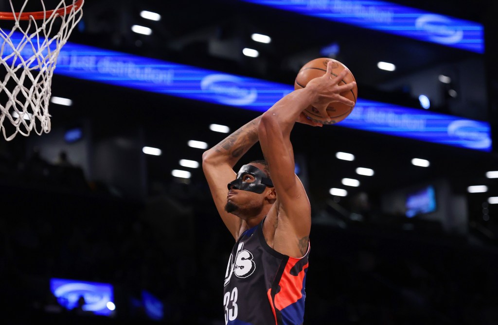 Nic Claxton slams home a dunk during the Nets' victory.