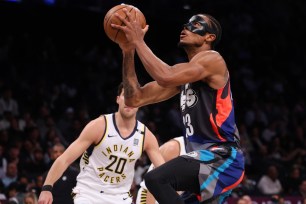 Nic Claxton, who scored 14 points, goes up for a shot during the Nets' victory.