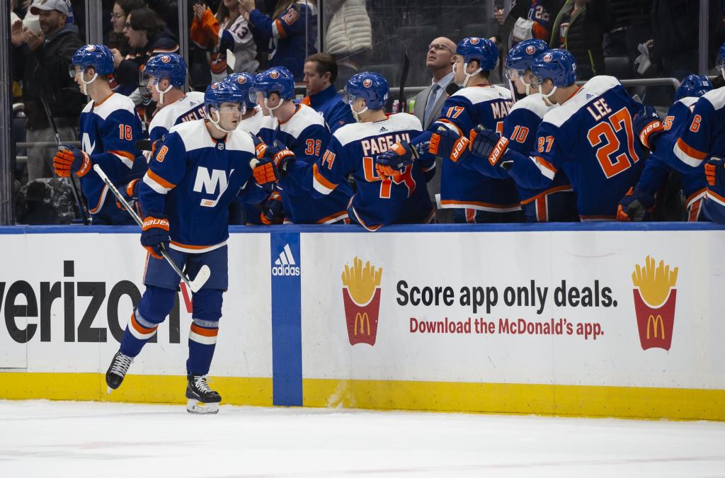 Noah Dobson celebrates with teammates after scoring a second-period goal in the Islanders' win.