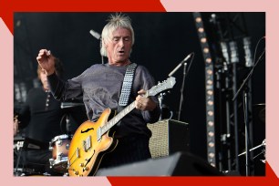 Paul Weller rocks out on guitar.
