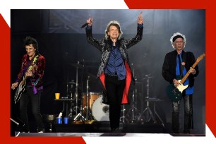 Rolling Stones members Ronnie Wood (L), Mick Jagger and Keith Richards rock out in concert.