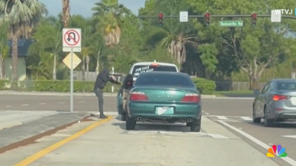 The alleged hired gunman was seen getting out of a green-tinted Acura after it was seen ramming Guerrero De Aguasvivas's SUV for about a half mile. 