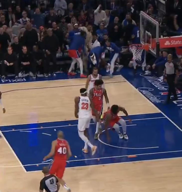Joel Embiid made the dunk, but went down.
