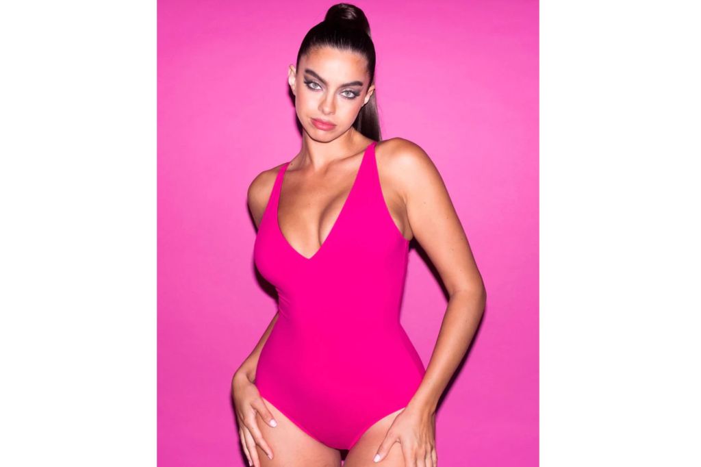 A woman in a hot pink swimsuit