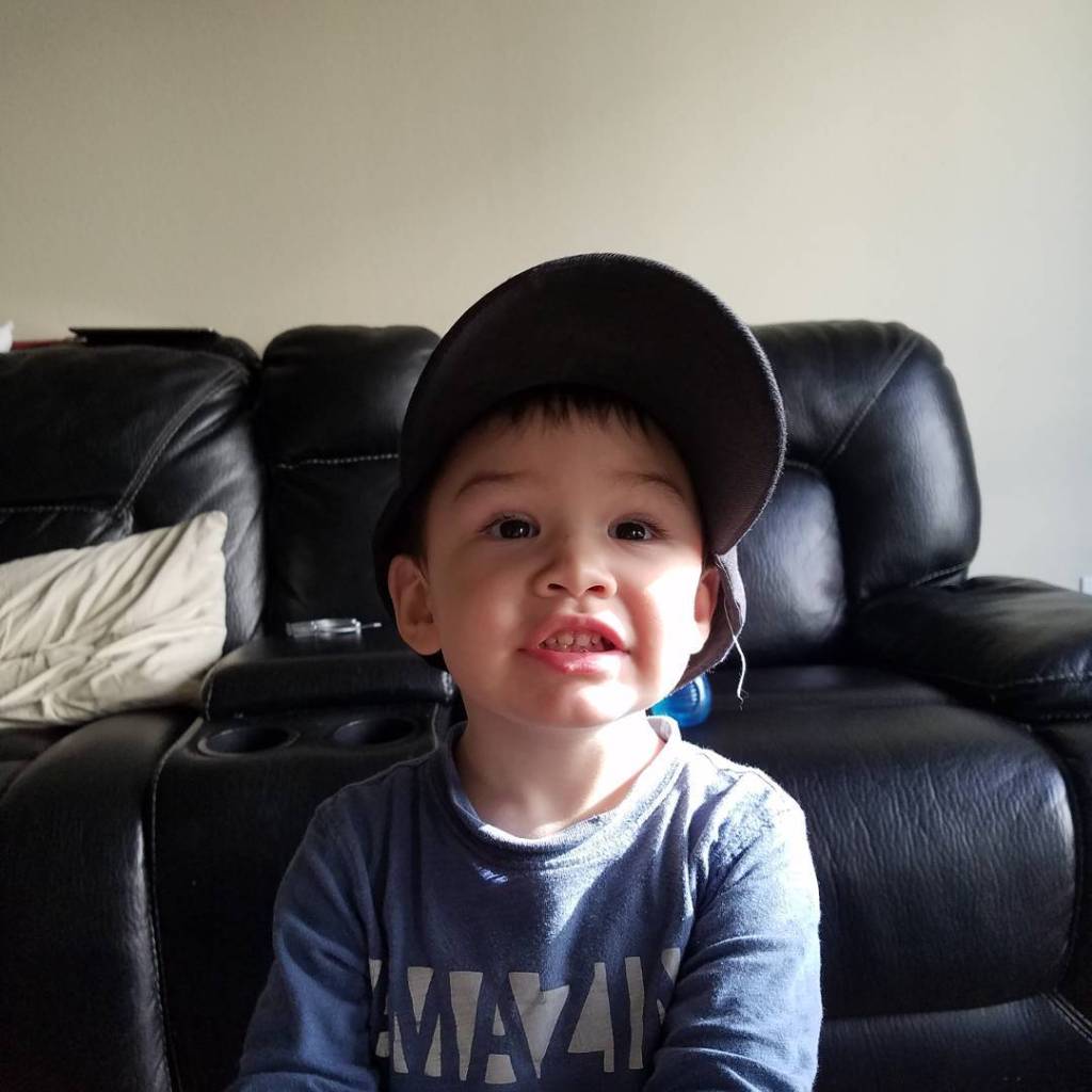 A photo of Aiden wearing a baseball cap