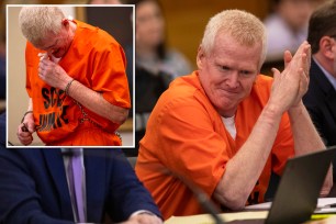 Alex Murdaugh in orange prison uniform conversing with his defense attorney Jim Griffin during a jury-tampering hearing at Richland County Judicial Center