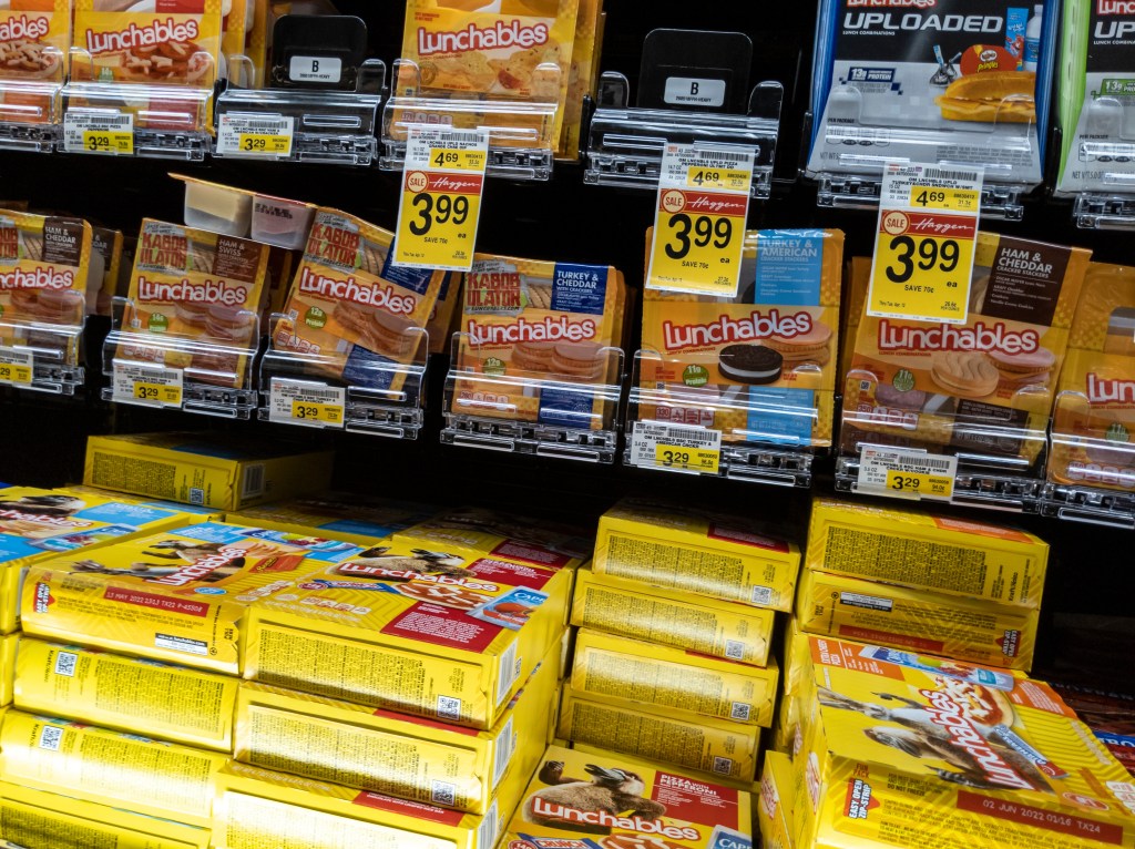 Angled view of various Lunchables for sale on a shelf inside a Haggen Northwest Fresh grocery store in Woodinville, WA, USA, April 2022.