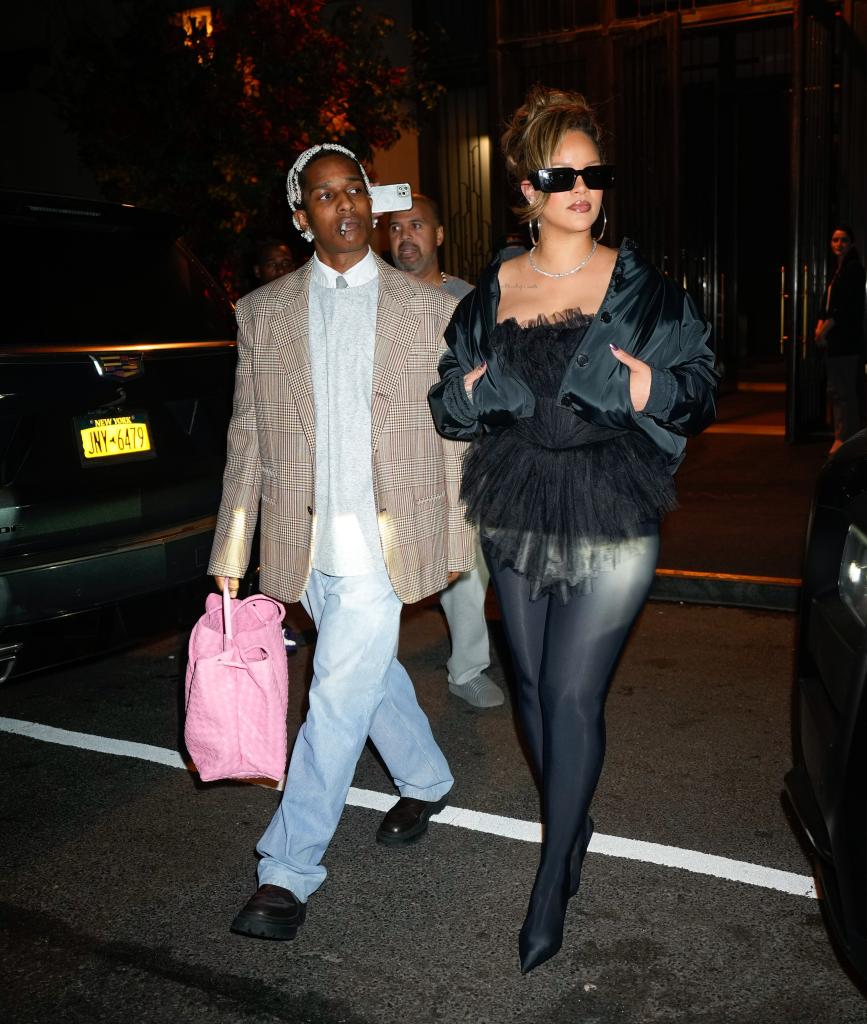 ASAP Rocky and Rihanna walking on a street while celebrating his 34th birthday at Carbone in New York City, October 2023