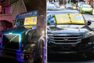 Barnacle parking enforcement device attached to the windshield of a car parked on North 9th Street in Reading, Pennsylvania.