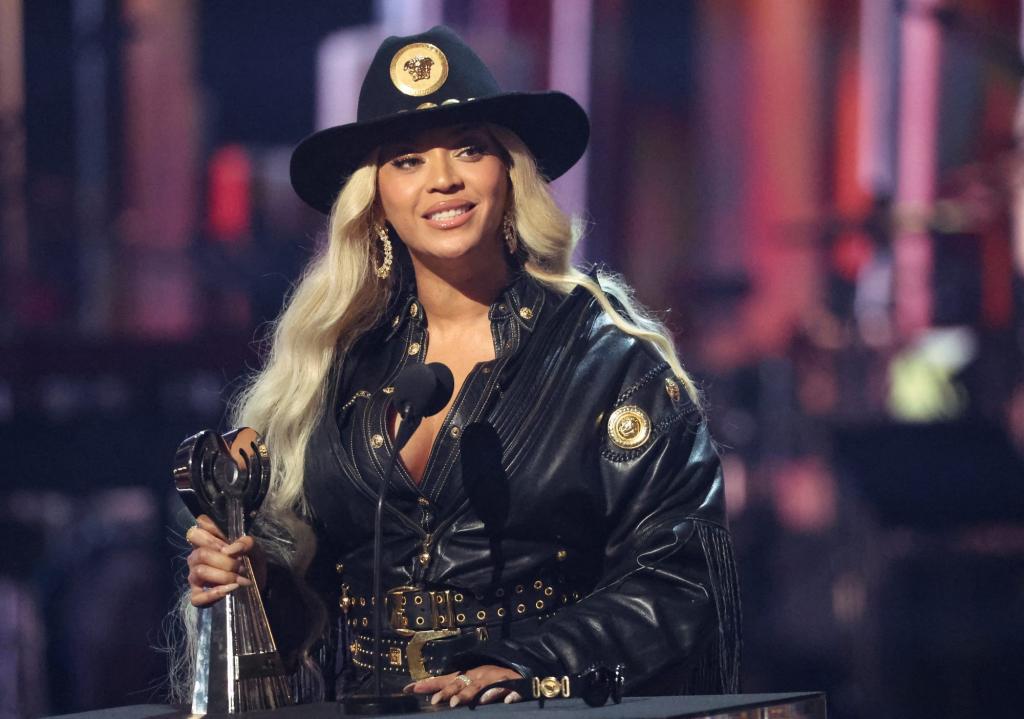 Beyonce in a black hat accepting the Innovator award at the 2024 iHeartRadio Music Awards in Los Angeles