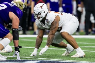 Texas defensive lineman Byron Murphy II (90) gets set at the line of scrimmage during the Allstate Sugar Bowl playoff game between the Texas Longhorns and the Washington Huskies on Monday, January 1, 2024 at Caesars Superdome in New Orleans, LA.