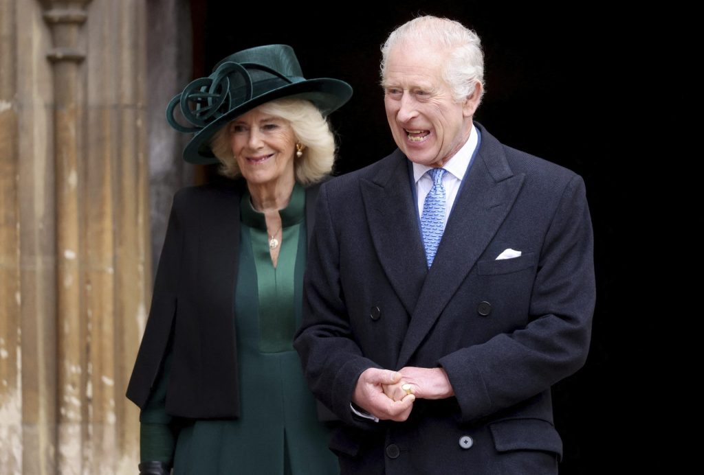 King Charles III and Queen Camilla exiting St. George's Chapel at Windsor Castle after Easter Matins Service