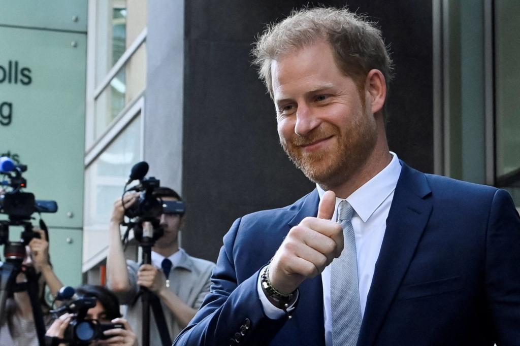 Prince Harry, Duke of Sussex, exiting the Rolls Building of the High Court in London, giving a thumbs up