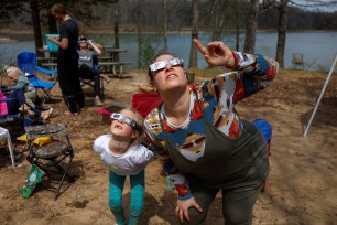 Stargazers trying out their eclipse glasses.