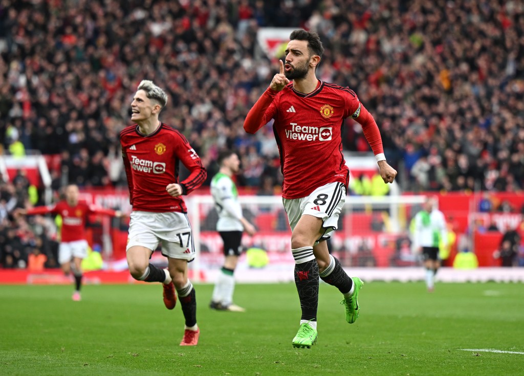 Bruno Fernandes of Manchester United celebrates scoring his team's first goal during the Premier League match between Manchester United and Liverpool FC.