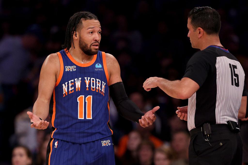 Jalen Brunson #11 of the New York Knicks reacts to a call and discusses with referee Zach Zarba #15 during the first half against the Chicago Bulls at Madison Square Garden on April 14, 2024 in New York City.