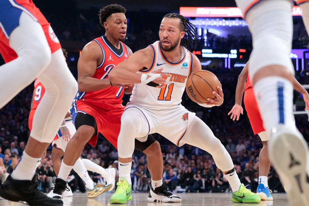 76ers Kyle Lowry tries to steal th ball away from New York Knicks guard Jalen Brunson #11 during the first quarter.