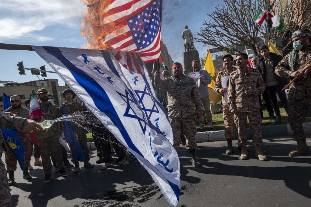 US and Israeli flags burning