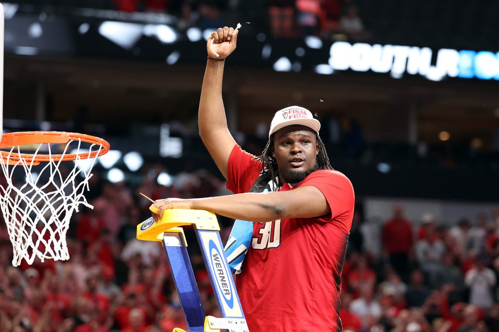 DJ Burns Jr. celebrates after NC State defeated Duke in the Elite Eight.