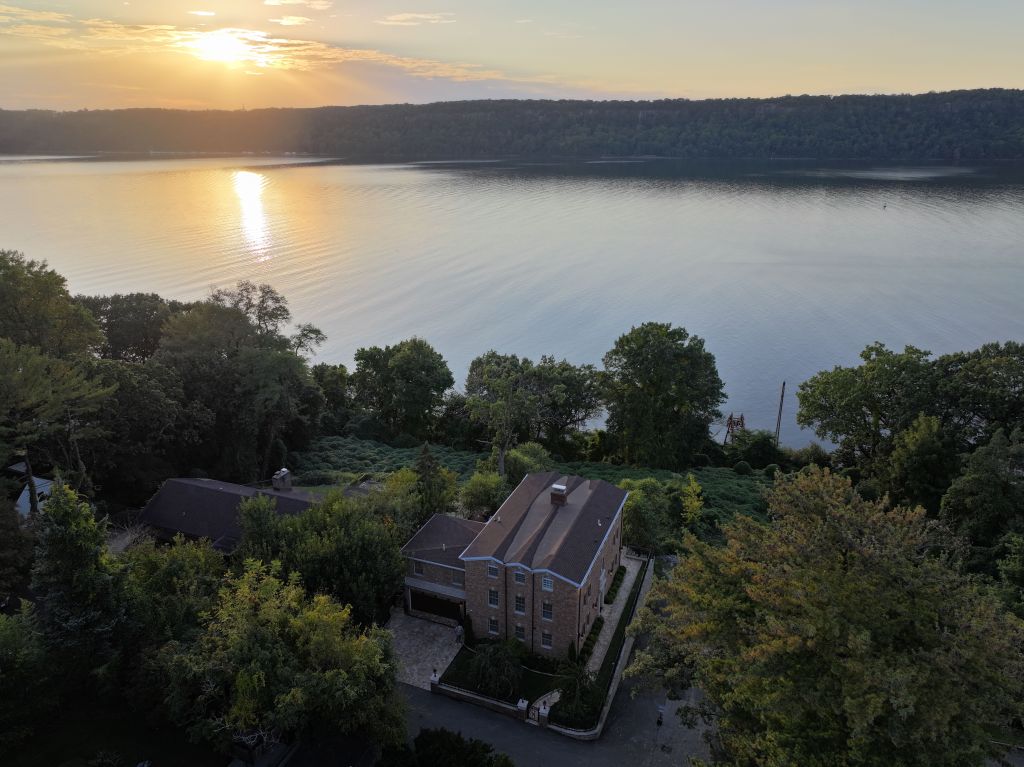 An evening view of the home's waterfront lot.