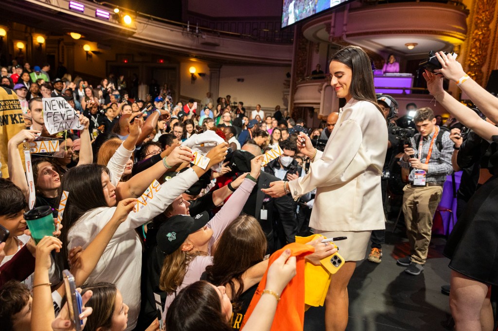 Caitlin Clark signs autographs before the WNBA Draft at the Brooklyn Academy of Music